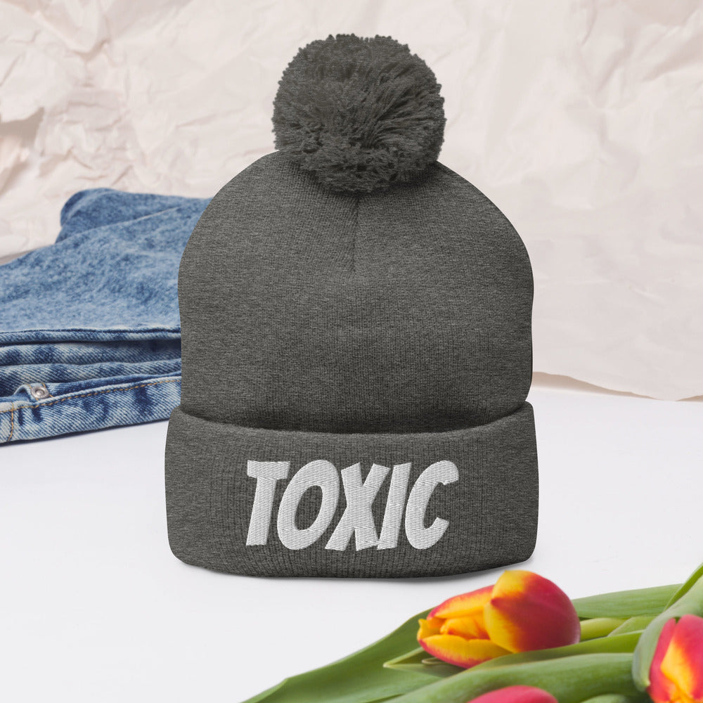 TOXIC Pom-Pom Beanie