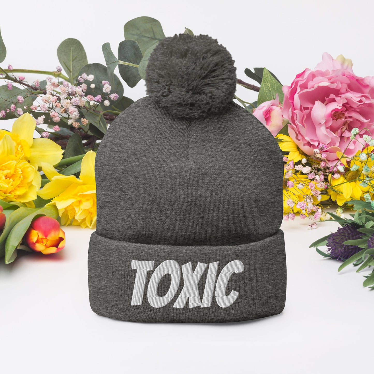 TOXIC Pom-Pom Beanie