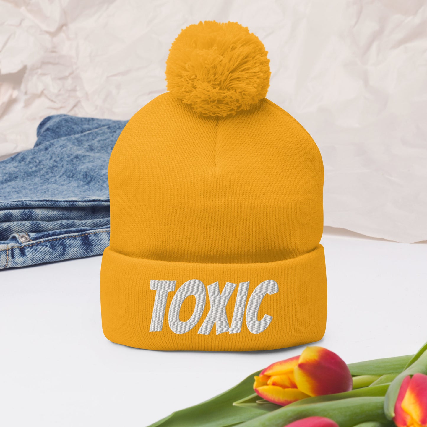TOXIC Pom-Pom Beanie