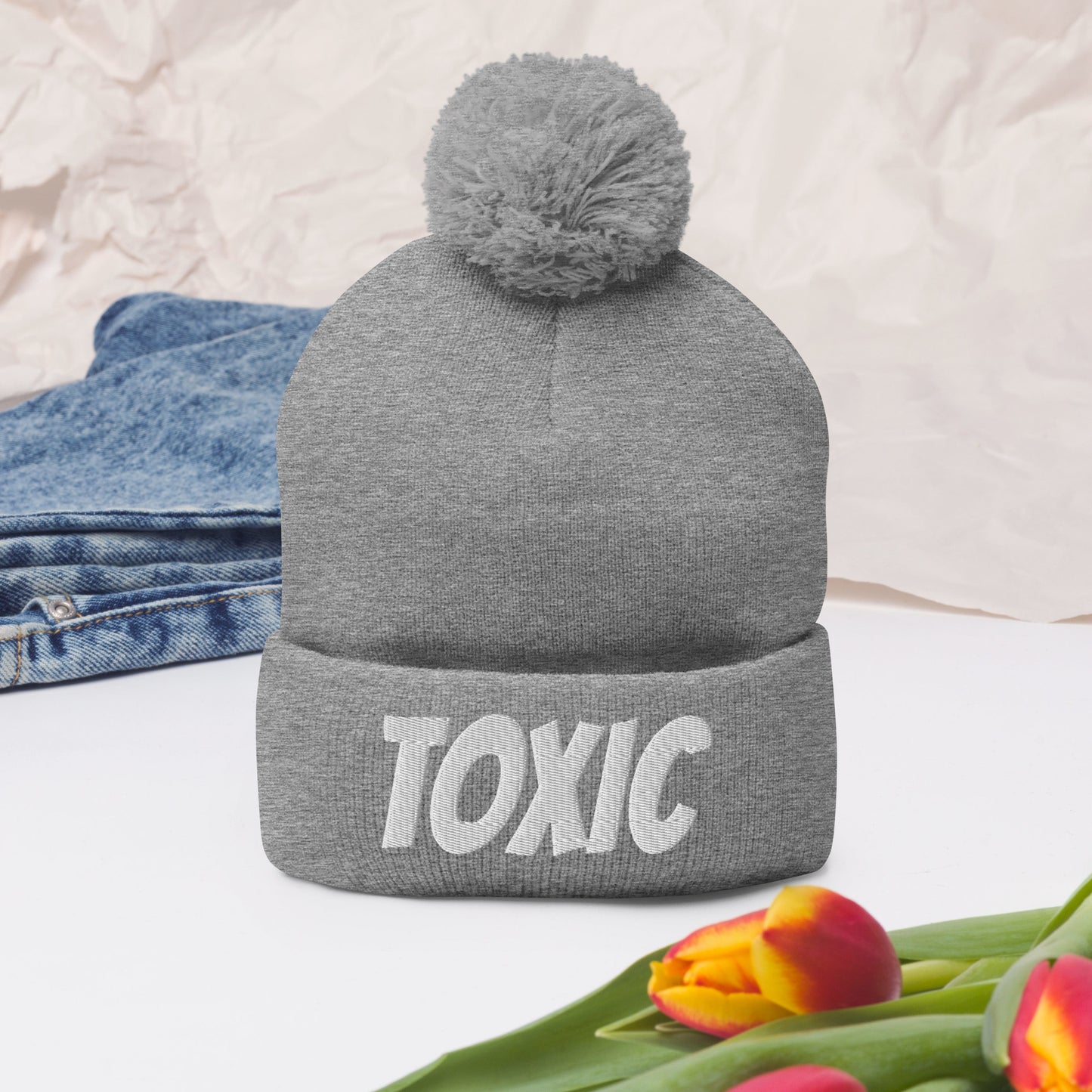 TOXIC Pom-Pom Beanie